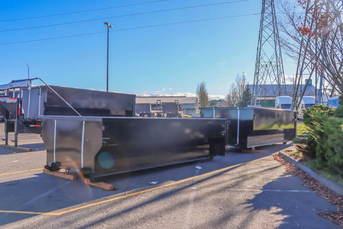 Roll-off dumpster ready for waste disposal at job site for 2 Yard Dumpster Rental in Brigham City